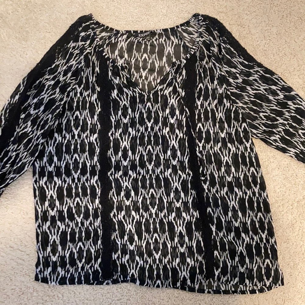 Express size medium black and white blouse with black lace down 3/4 arm.